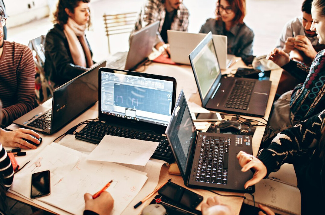 diverse group using technology