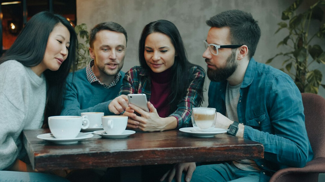 people discussing technology in meeting