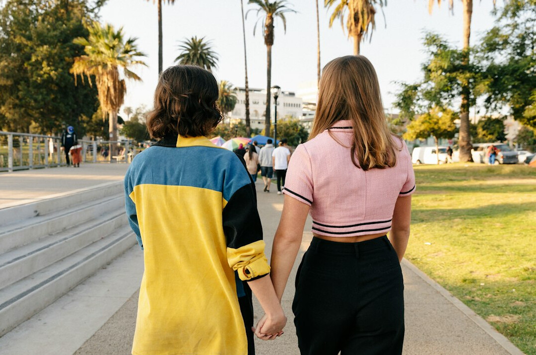 couple holding hands outdoors