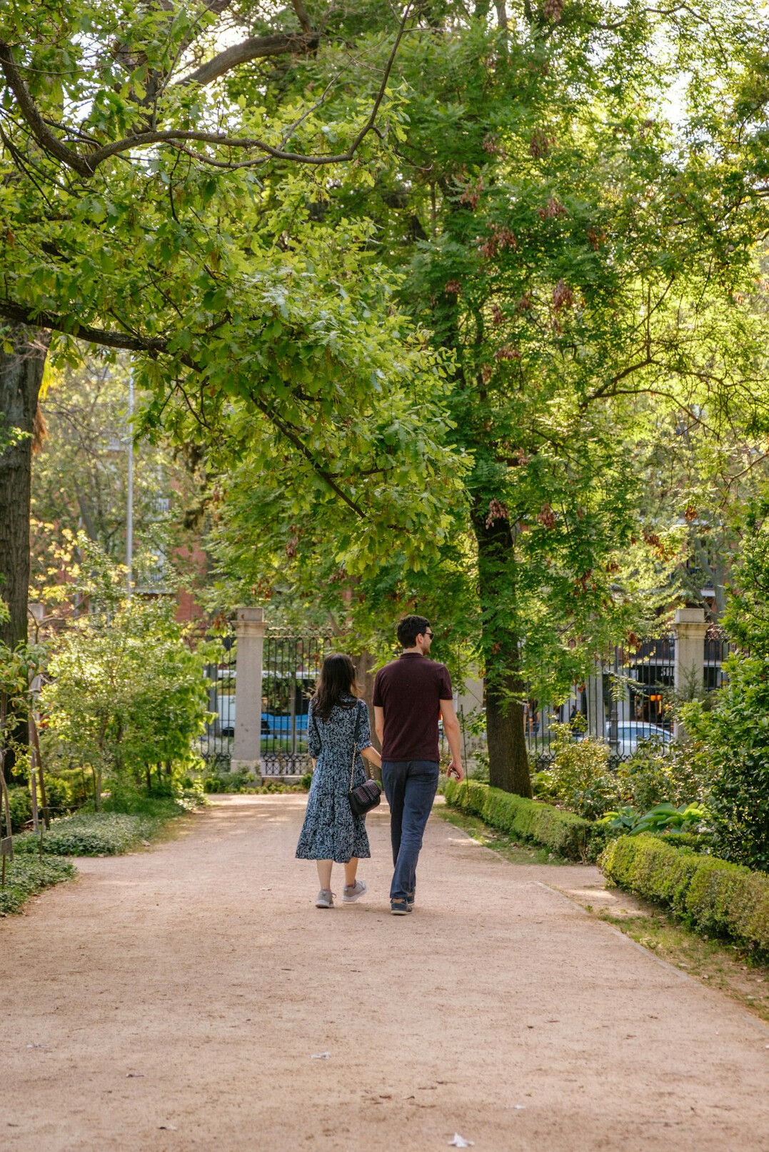 young couple walking in park